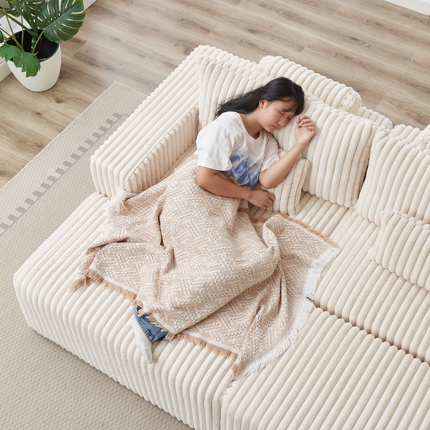 Plush cream corduroy sofa with channel tufting perfect for a cozy living room