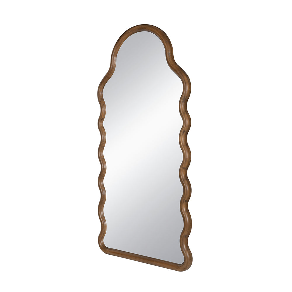 Tall wooden accent mirror with a unique wavy frame and mirrored glass