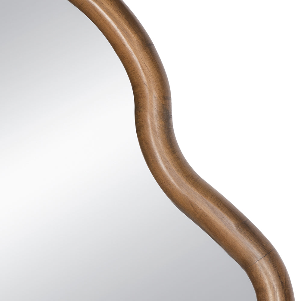 Curved wooden frame for a decorative mirror showing rich grain detail