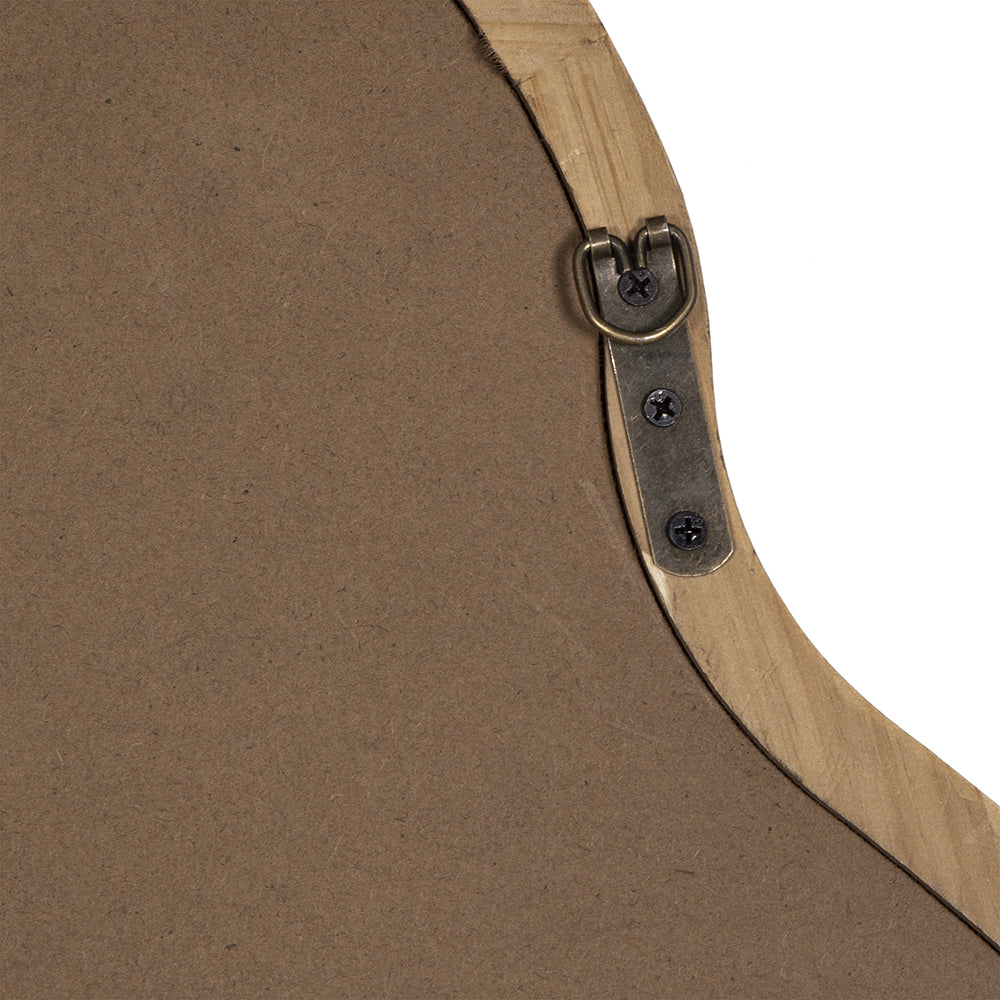 Antique brass hanging hardware on the back of a rustic wooden framed mirror