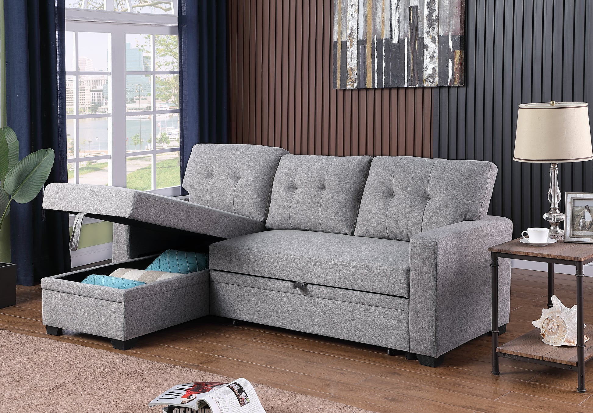 Gray fabric sectional sofa with pullout bed feature and hidden storage compartment