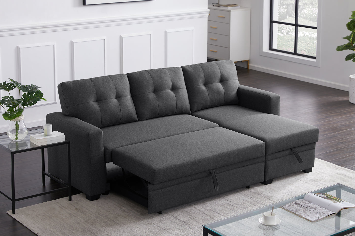 Dark gray tufted sofa bed with chaise perfect for small spaces