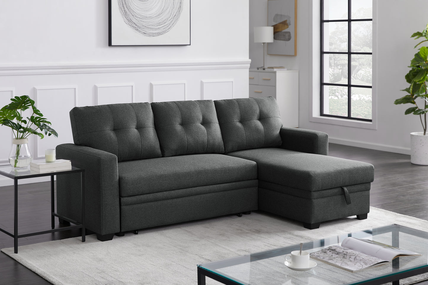 Dark grey fabric sectional sofa with tufted cushions and storage chaise