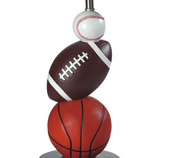 Sportsthemed table lamp with basketball football and baseball stacked