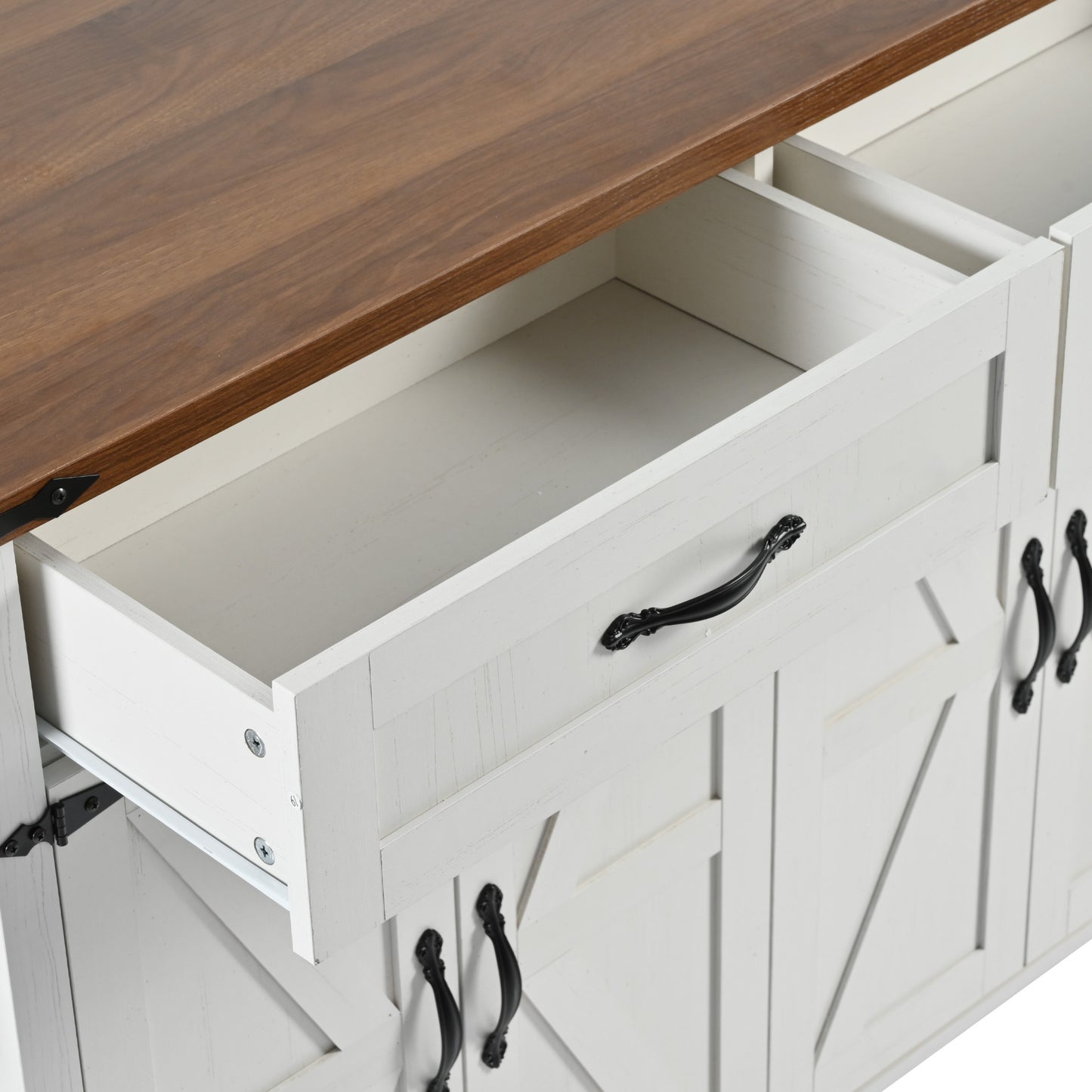 White farmhouse buffet with distressed wood top and black ornate hardware