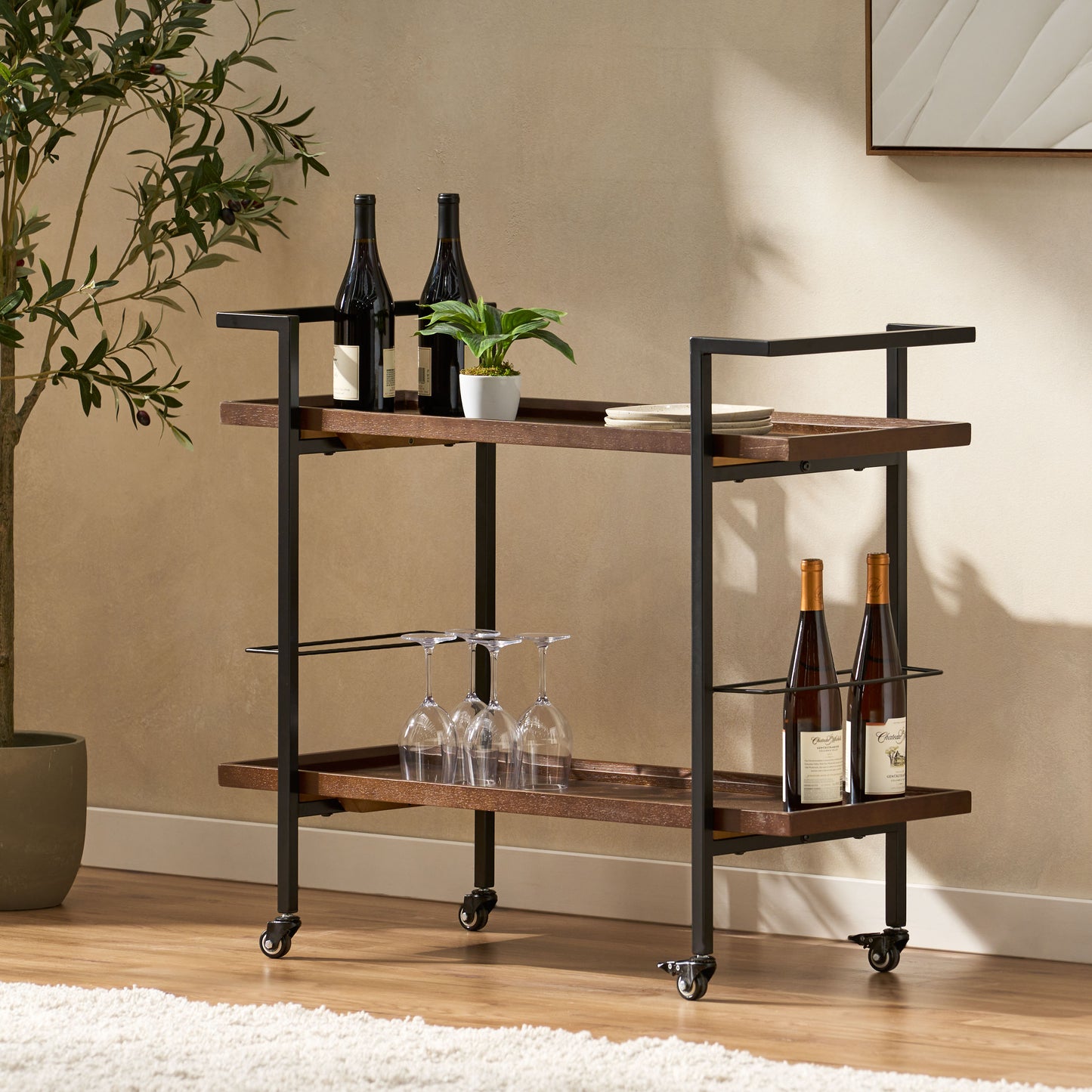Stylish walnut bar cart with black metal frame holding wine bottles and glasses