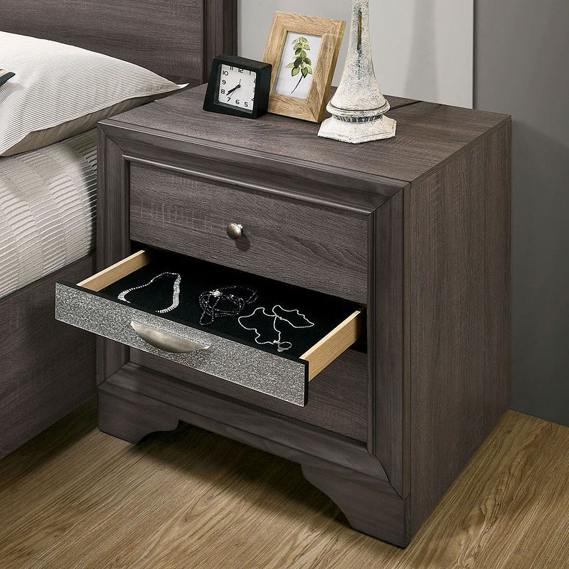 Gray wood nightstand with one open drawer revealing jewelry