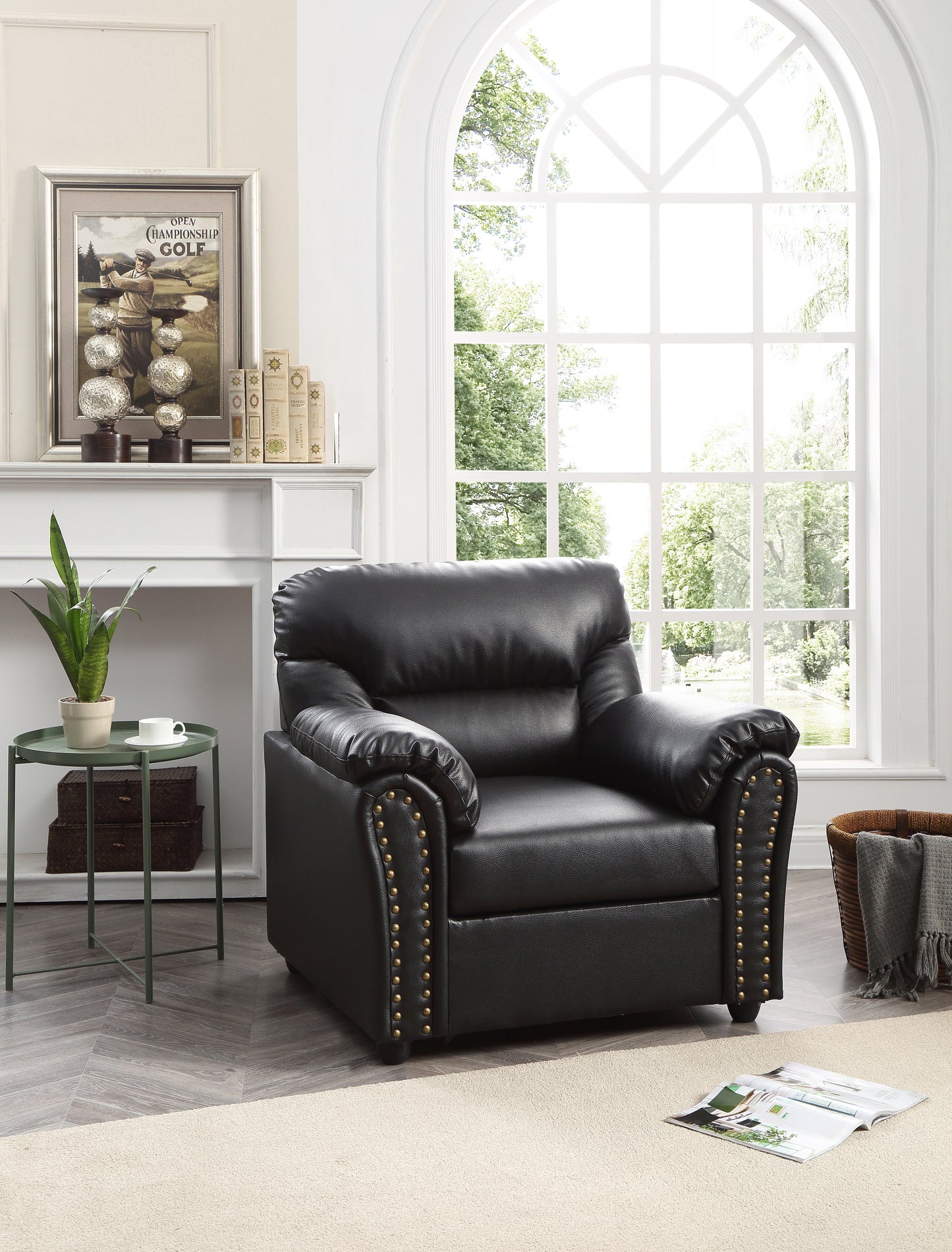 Black leather recliner chair with ornate brass nailhead trim and plush cushioning
