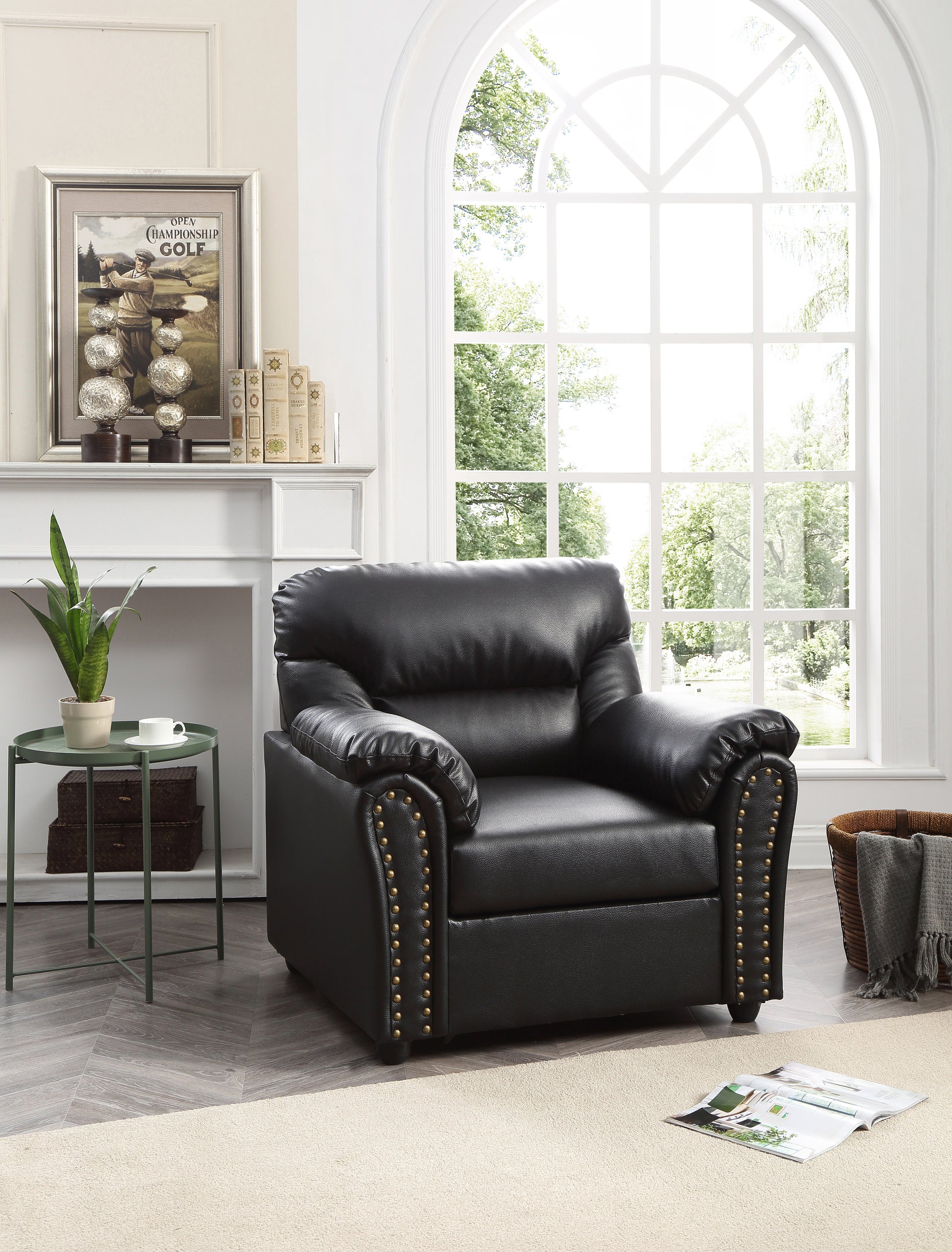 Black leather recliner chair with ornate brass nailhead trim and plush cushioning