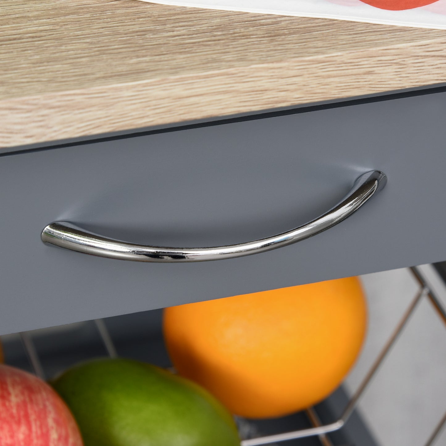 Shiny chrome drawer pull on a grey storage unit