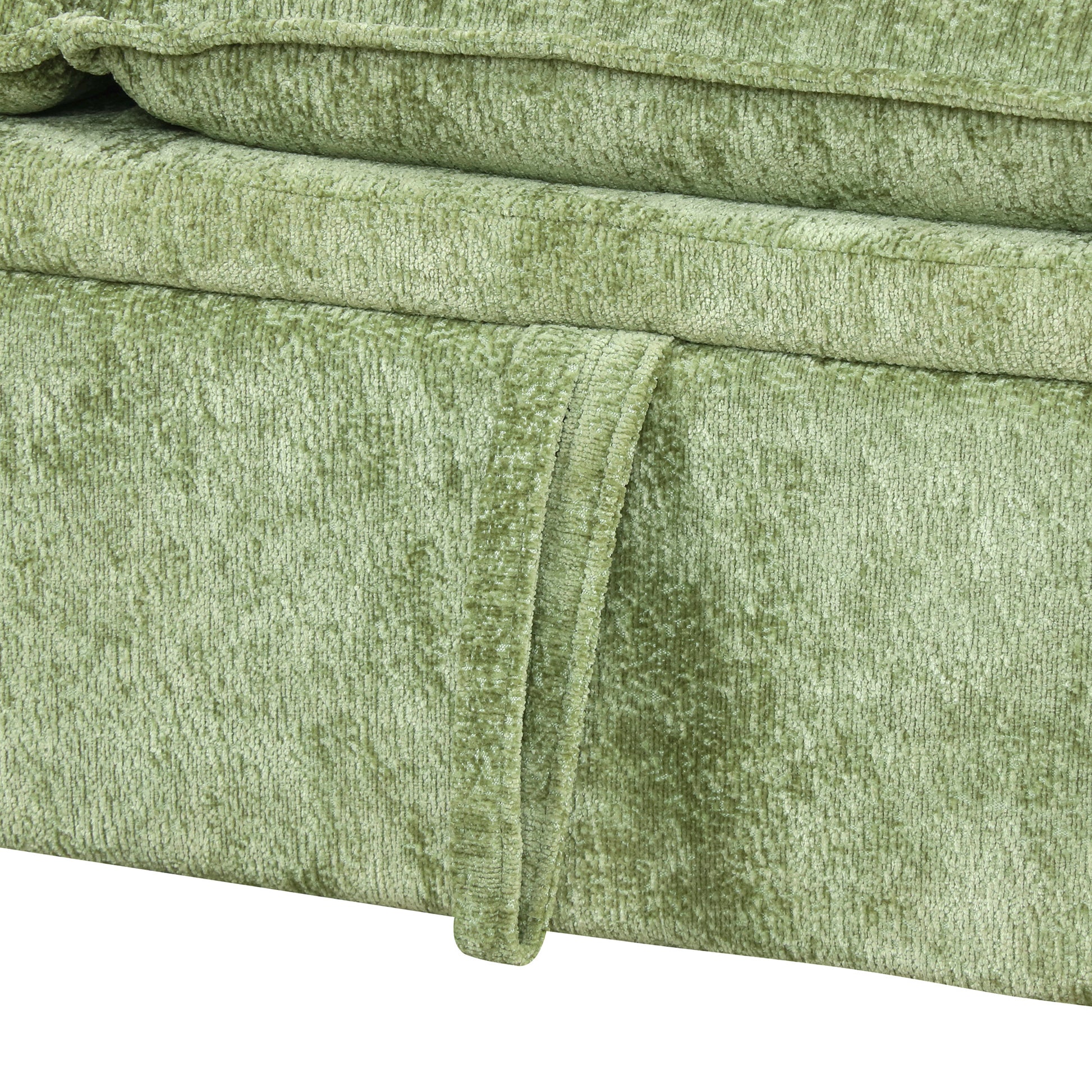 Closeup of textured light green chenille fabric on a sofa cushion soft and inviting