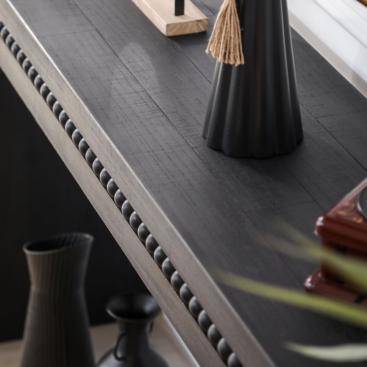 Dark grey distressed wood console table with beaded trim detail perfect for entryways