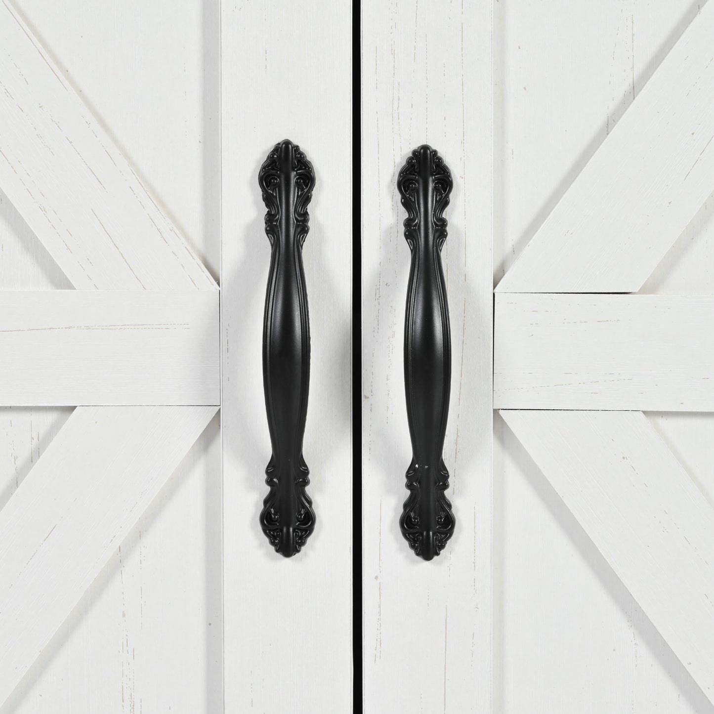 White barn door cabinet with decorative black hardware