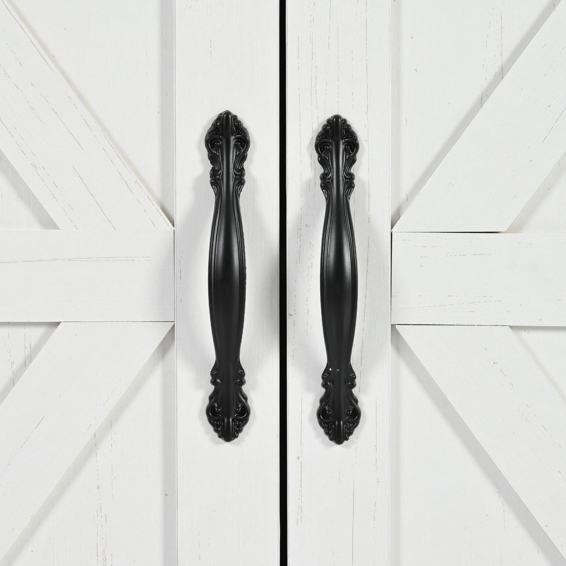 White barn door cabinet with decorative black hardware