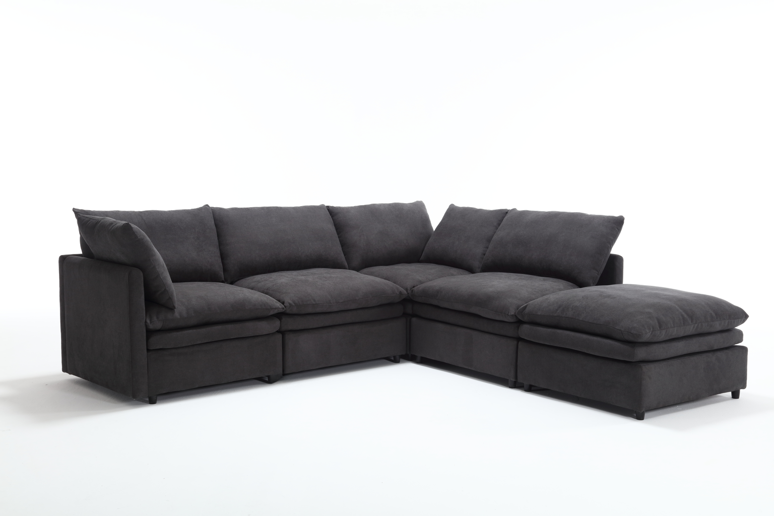 Dark gray fabric sectional sofa with plush cushions for a modern living room