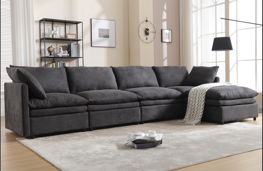 Deep charcoal sectional sofa with plush cushions and chaise lounge