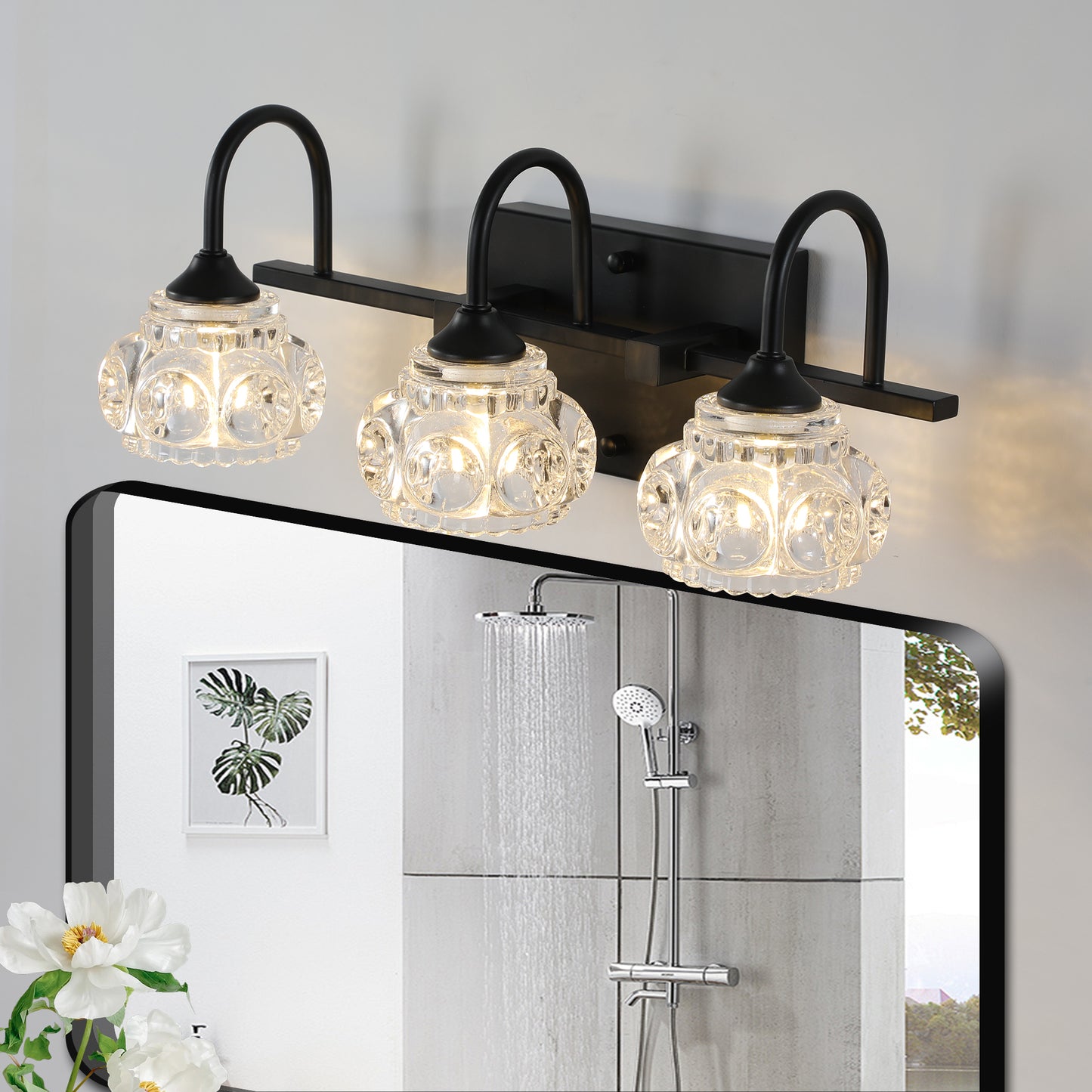 Black threelight vanity light with clear seeded glass globes