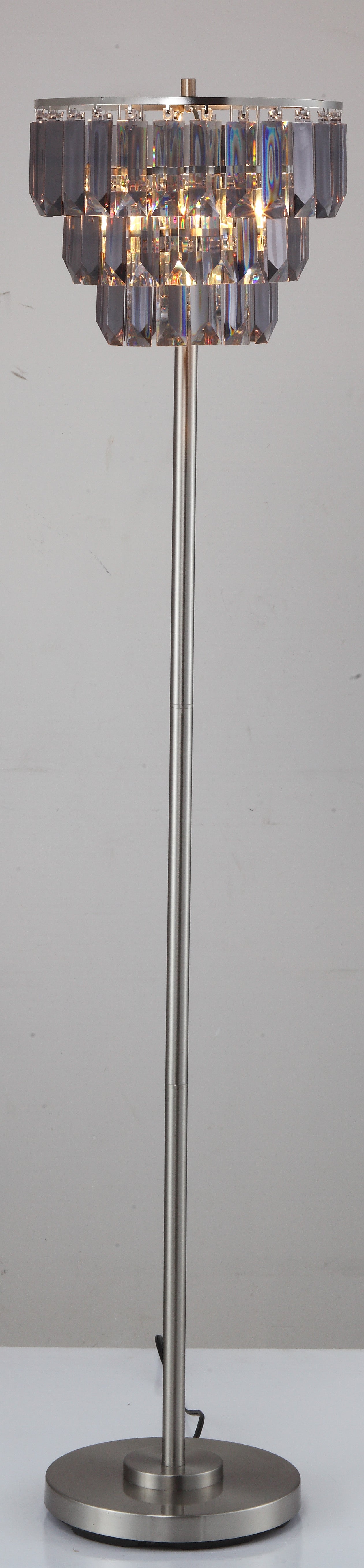 Modern floor lamp with a brushed nickel finish and tiered crystal accents