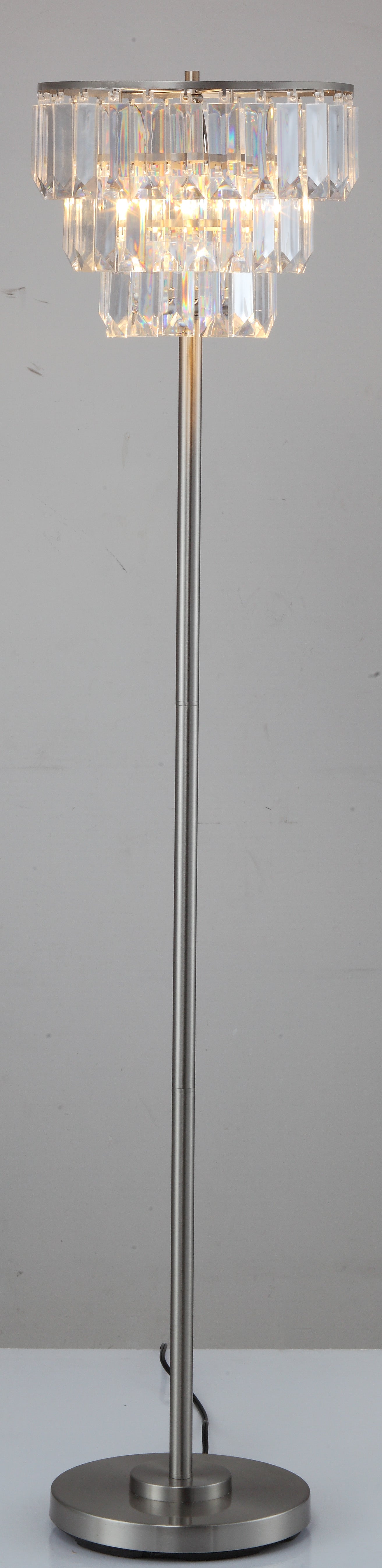 Modern floor lamp with stacked crystal tiers and a brushed nickel base