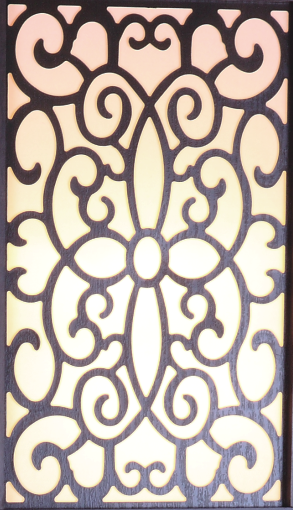 Ornate dark wood vent cover with intricate scrolling detail and cream backing