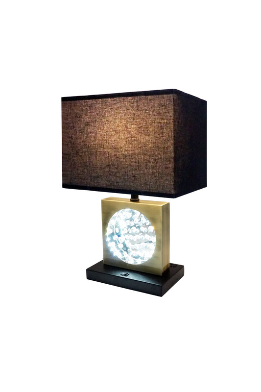Modern brass cube lamp with textured charcoal shade and illuminated crystal details