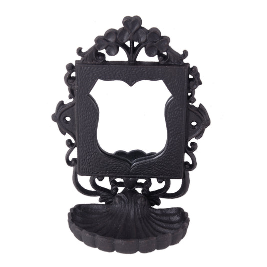Ornate black cast iron wall mount with shellshaped drip catcher