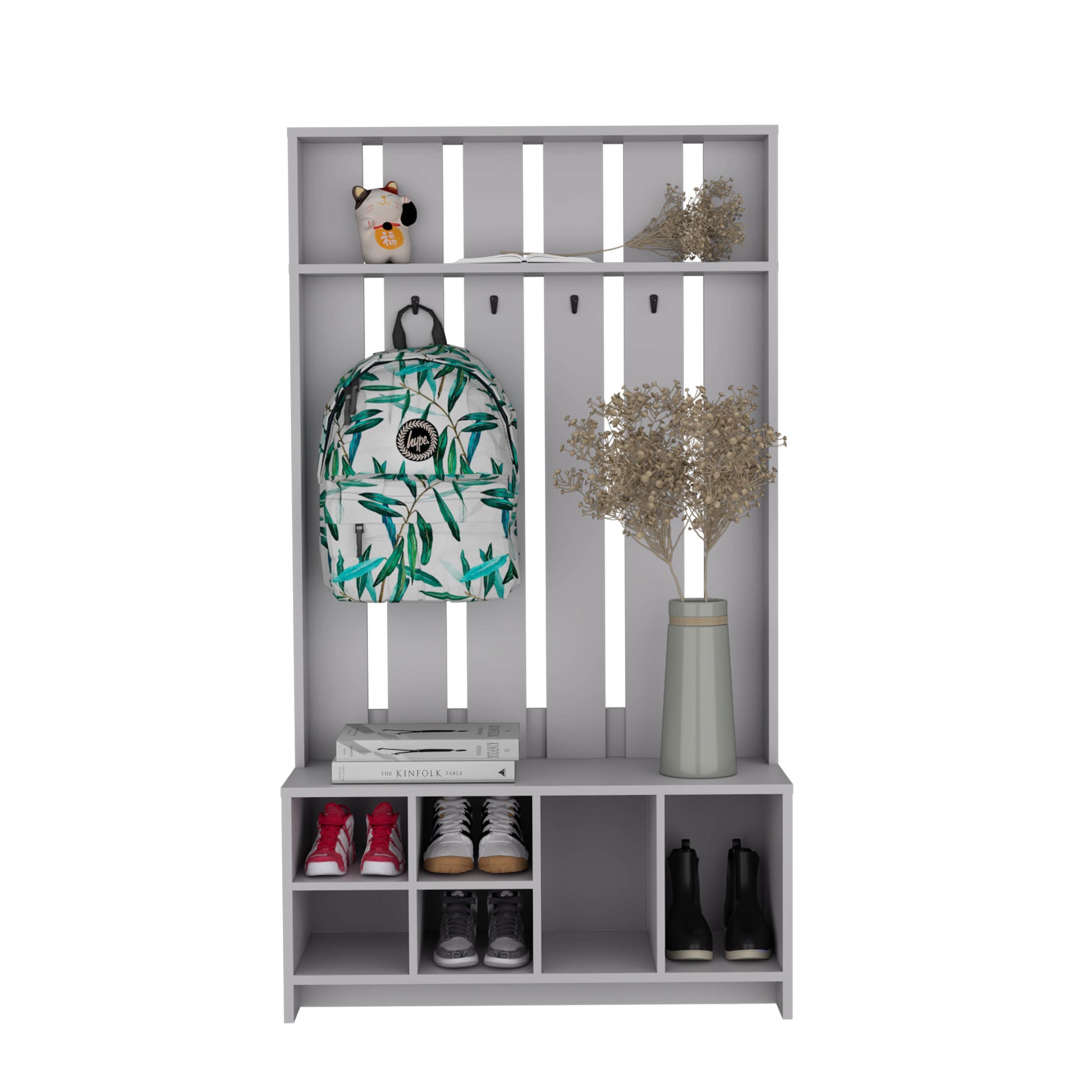 Grey entryway shelf unit with hooks housing a patterned backpack and shoes