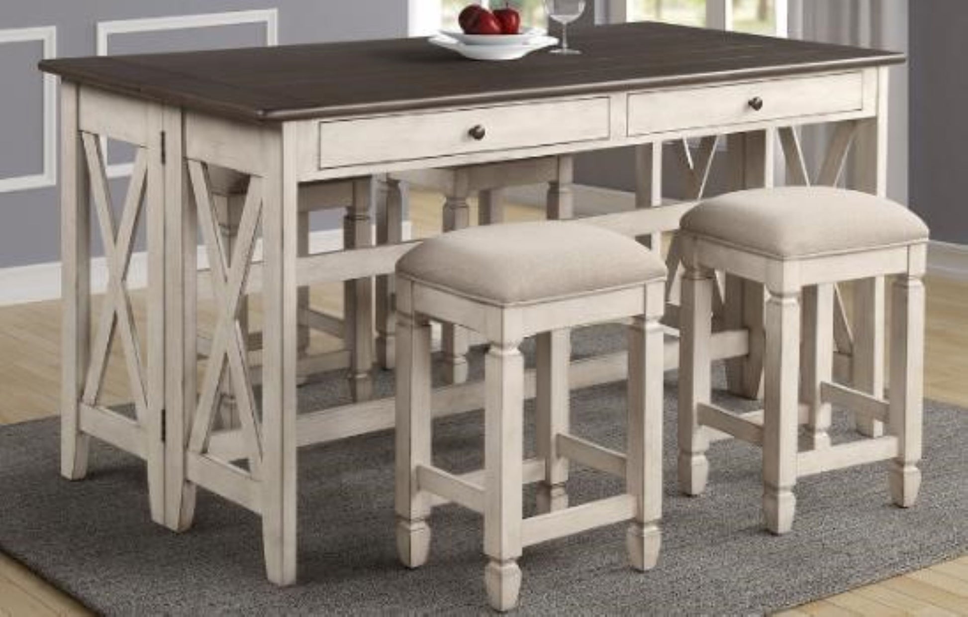 Distressed white wood counter height table with dark wood top and two upholstered stools