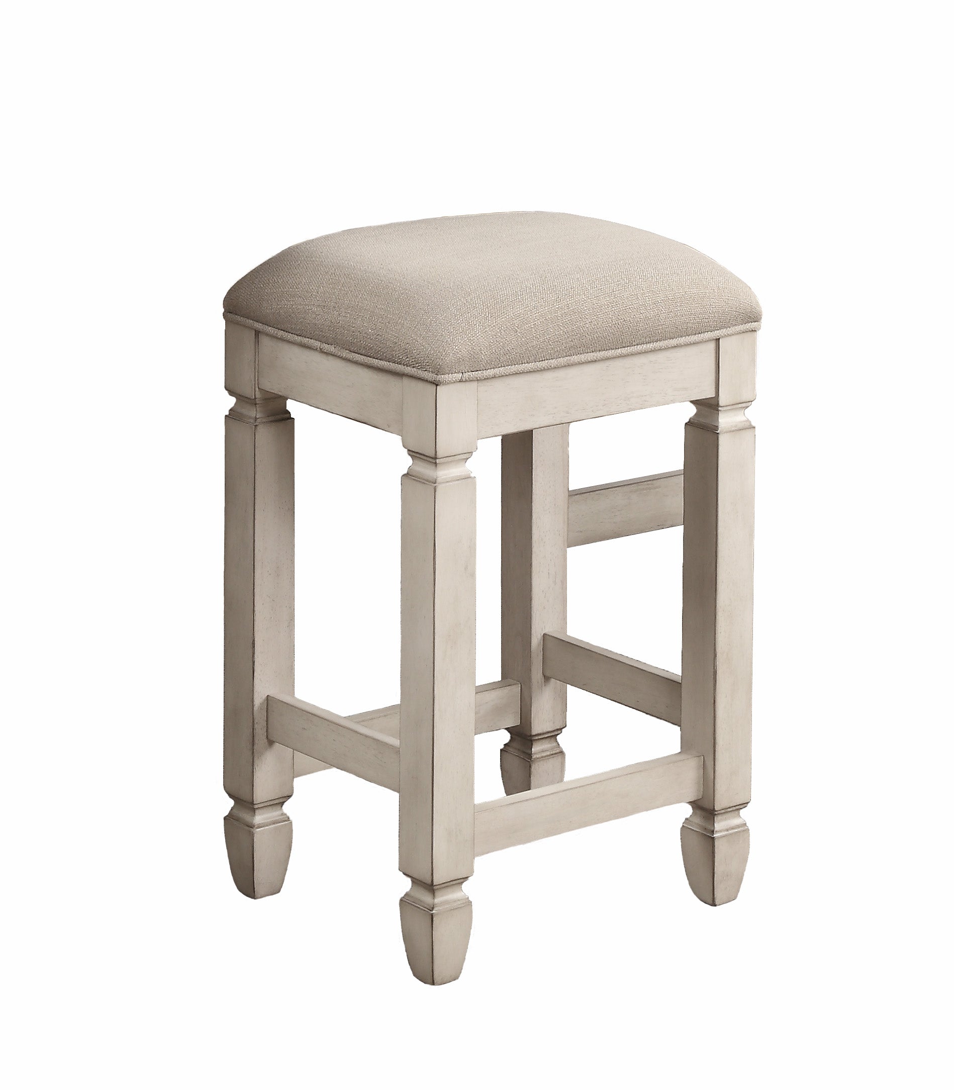 Cream upholstered square stool with distressed white wooden base and legs