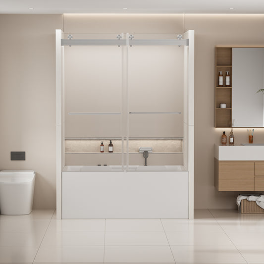 Modern white bathtub with clear sliding glass shower doors and brushed nickel hardware