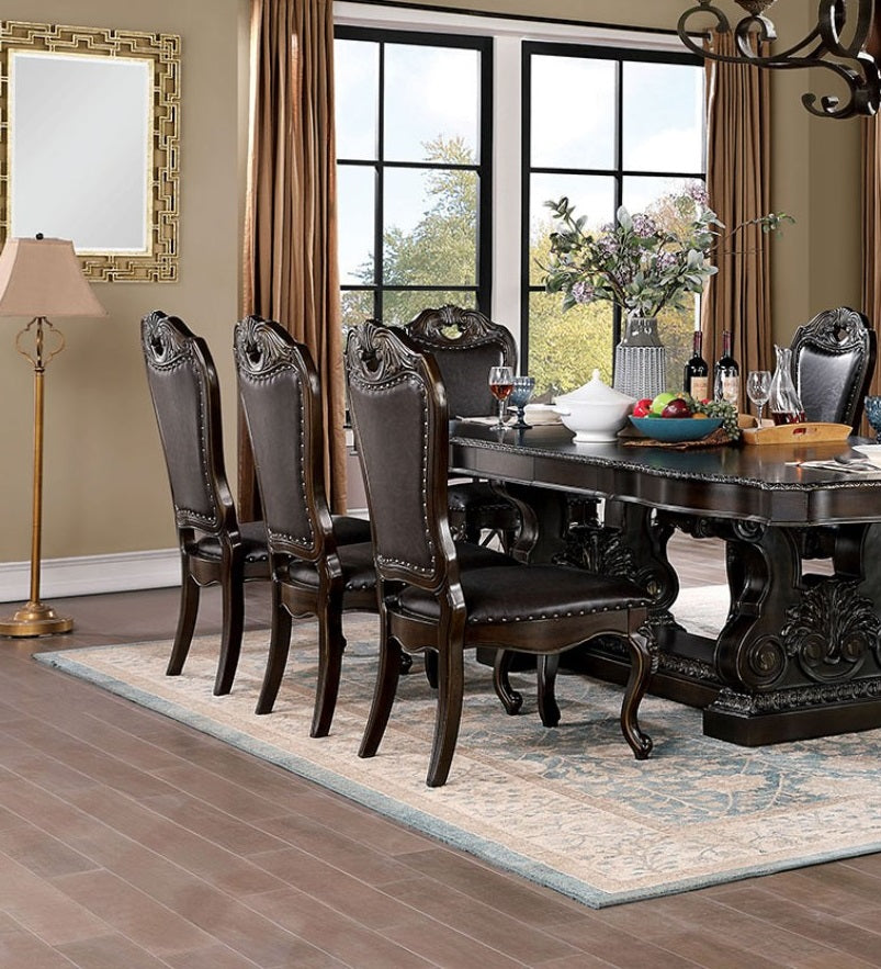 Dark mahogany dining chairs with upholstered seats and nailhead trim