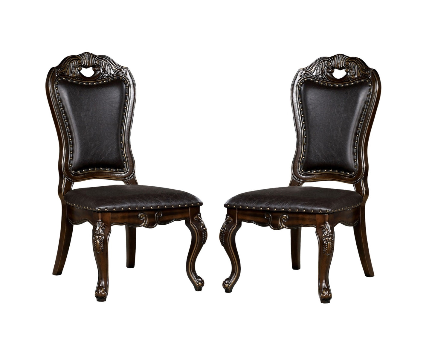 Ornate dark brown dining chairs with tufted faux leather seats and carved wooden legs