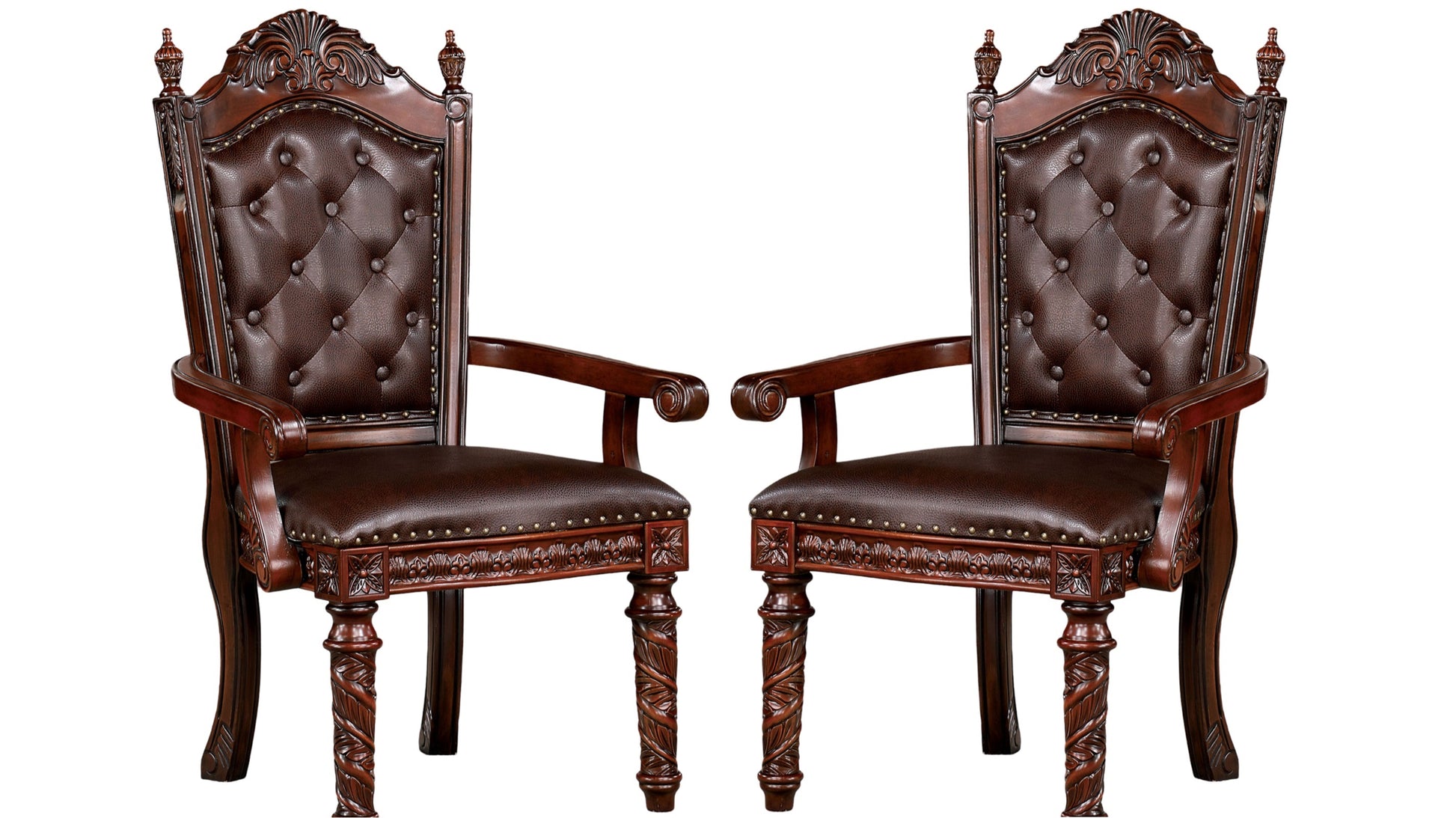 Two ornate brown leather tufted armchairs with carved wooden legs ideal for a dining room