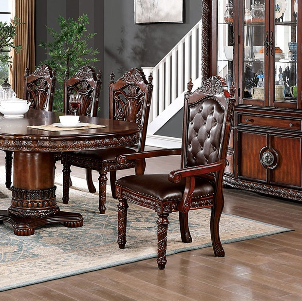 Ornate dark wood dining chair with tufted brown leather upholstery and carved legs