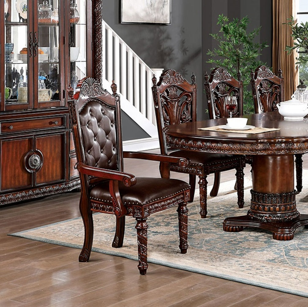 Tufted brown leather armchair with mahogany wood trim perfect for a formal dining set