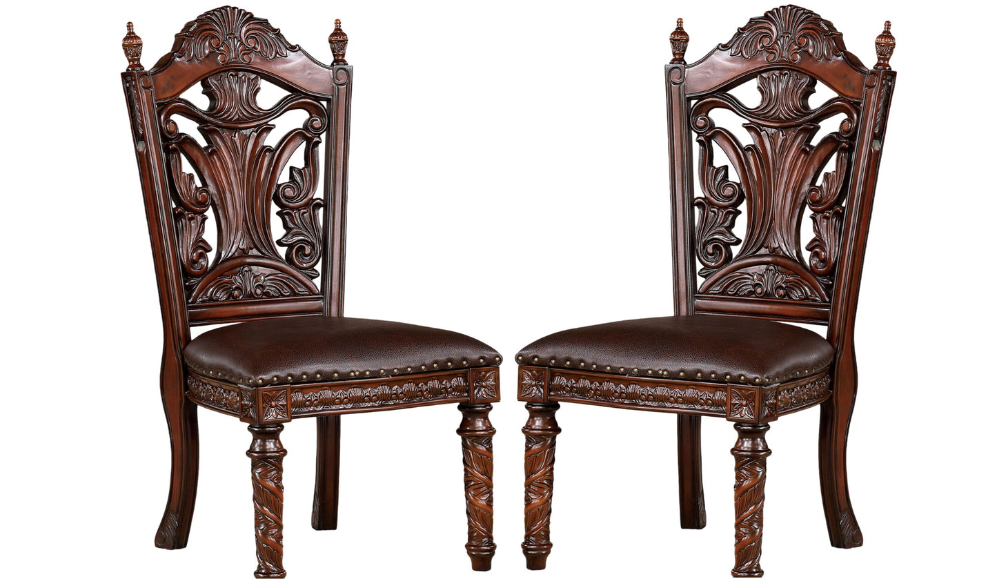 Ornate dark brown wood dining chairs with embossed leather seats and carved legs