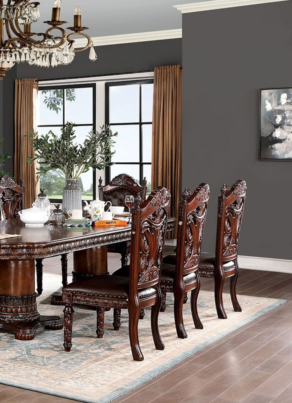 Ornate dark wood dining chairs with tufted brown leather seats and intricate carved backs