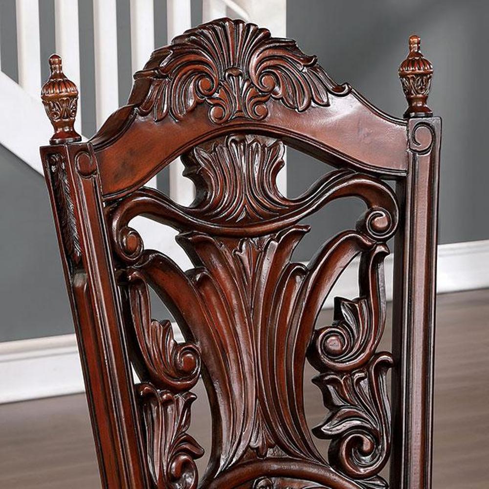 Ornate mahogany dining chair with carved acanthus leaf back detail
