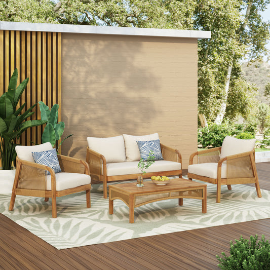 Natural wood outdoor furniture set with cream cushions and geometric pillows