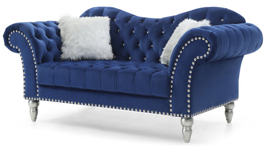 Deep blue velvet chesterfield loveseat with silver nailhead trim and ornate legs