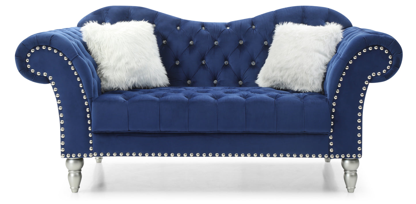 Elegant navy blue velvet sofa with diamond tufting and silver nailhead trim