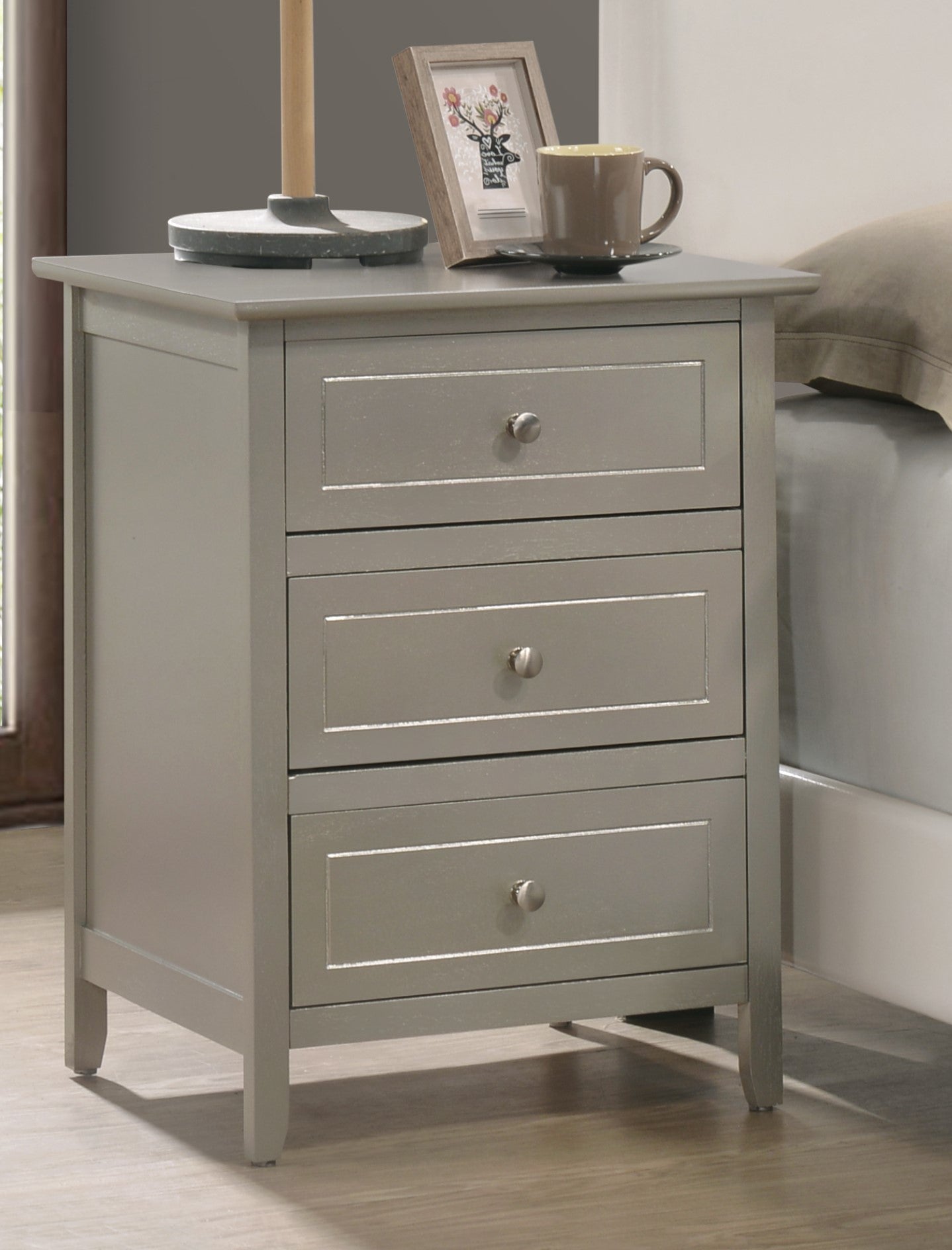 Threedrawer gray nightstand with silver hardware perfect for bedroom storage