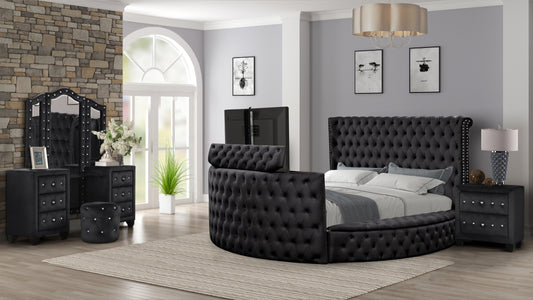 Black velvet upholstered round bed with tufted headboard and crystal accents