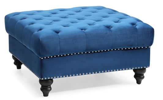 Blue velvet tufted ottoman with silver nailhead trim and dark wood legs