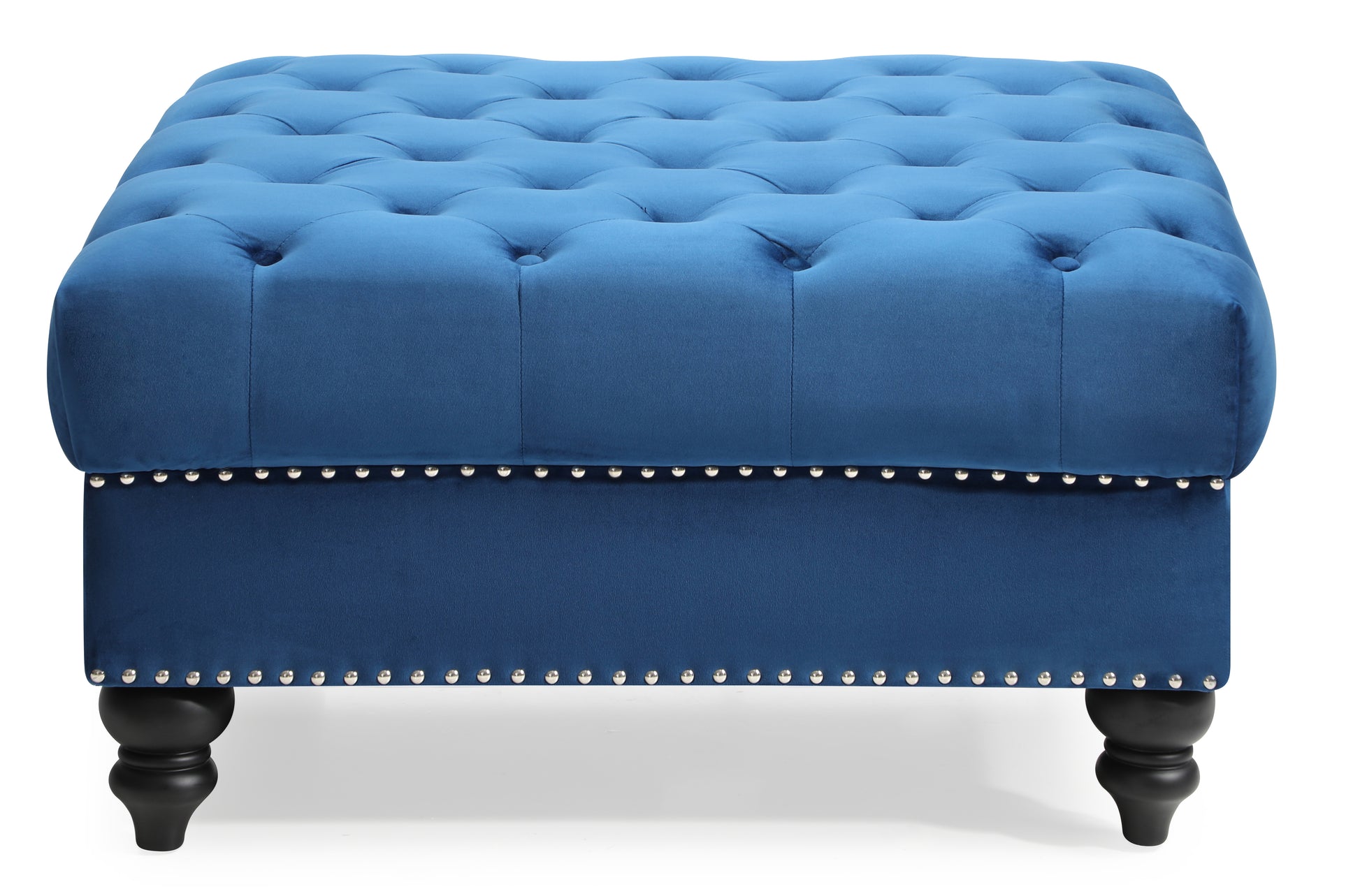 Deep blue velvet tufted ottoman with silver nailhead trim and carved wooden legs