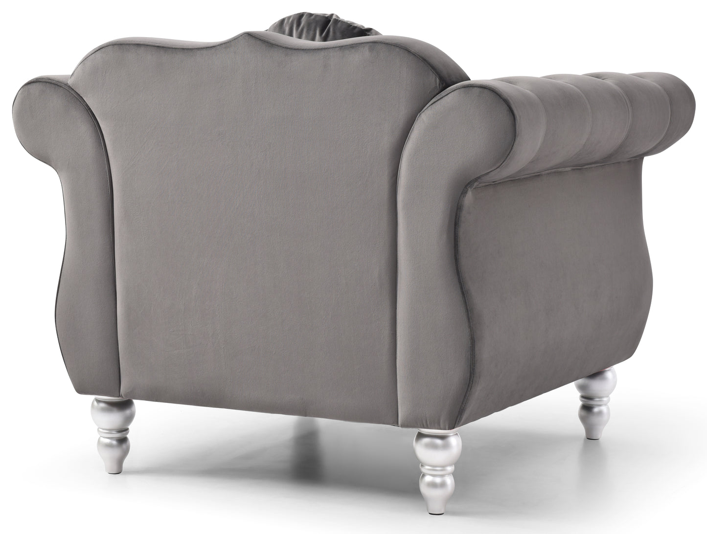 Gray velvet armchair with button tufting and silver legs