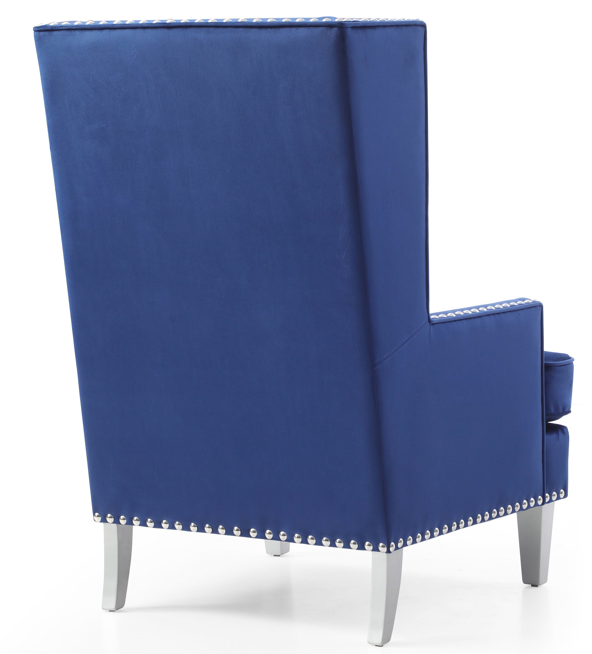 Deep blue velvet wingback armchair with silver stud accents and light grey legs