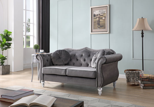 Tufted grey velvet loveseat with silver nailhead trim and ornate legs