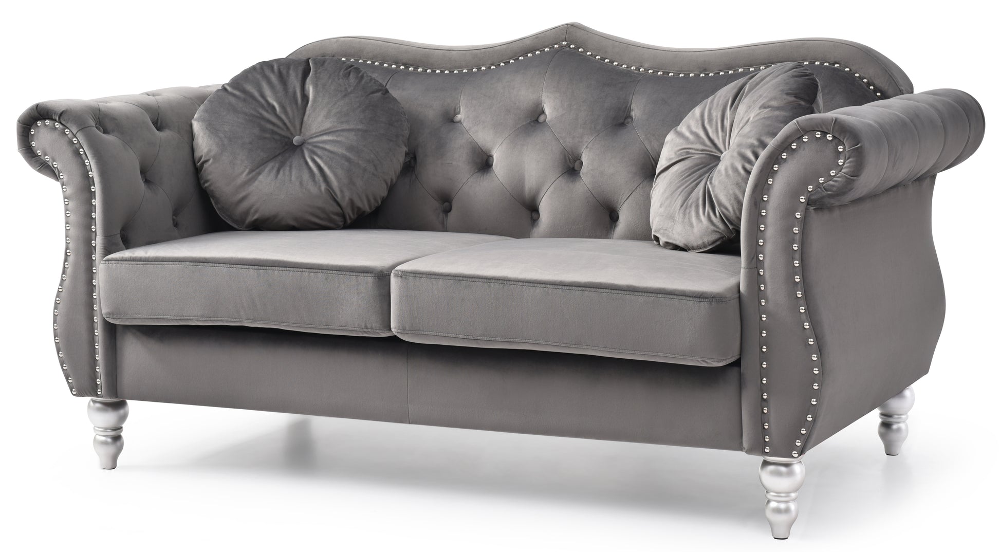 Grey velvet chesterfield loveseat with decorative silver nailhead trim and plush cushions