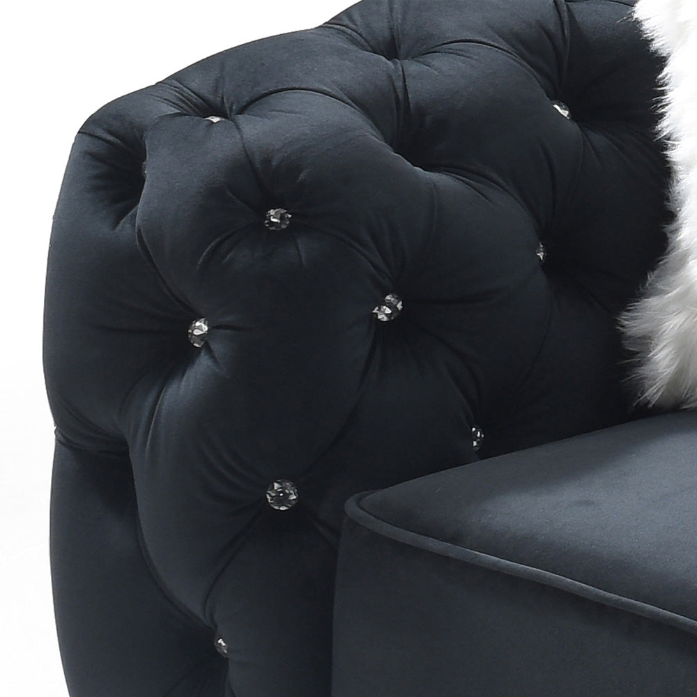 Black velvet armchair with crystal buttons and tufted upholstery